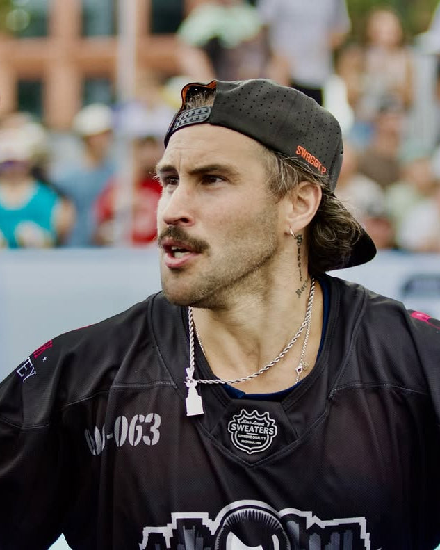 Swaggy P wearing a black jersey at Chiclet Cup by Men's League Sweatrs