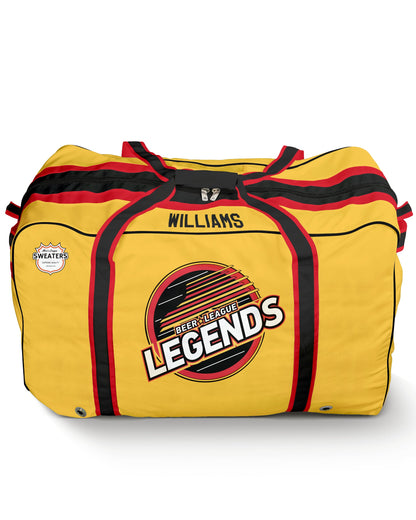 A yellow duffel bag styled like a sports jersey, featuring black and red stripes, a large 'LEGENDS' logo on the front, and the name 'WILLIAMS' printed above it.