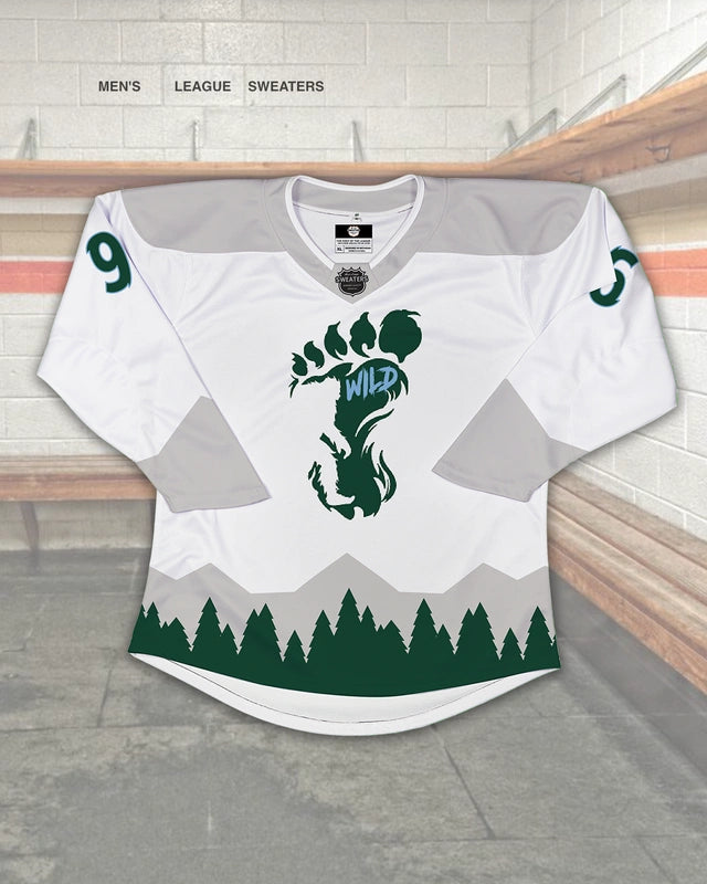 Custom  white hockey jersey design for the Wild with Bigfoot, tree, and mountains