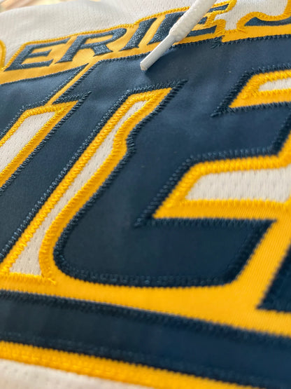 Close up of a custom hockey jersey in embroidered tackle twill 