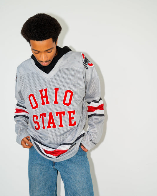 Person wearing an Ohio State jersey against a white background
